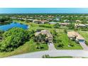 Wide aerial shot displaying a single-Gathering home with pristine landscaping and picturesque neighborhood at 618 148Th Ne Ct, Bradenton, FL 34212