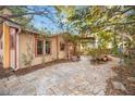 Landscaped backyard with stone patio and pergola at 1721 8Th Street, Sarasota, FL 34236