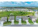 Wide aerial view of a residential community, highlighting the home's location and neighborhood layout at 17669 Cantarina Cv, Bradenton, FL 34211