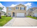 Charming two-story home with a neatly paved driveway and a well-manicured front yard at 259 Tierra Verde Way, Bradenton, FL 34212