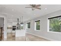 Bright and airy living room featuring lots of natural light, tile flooring, and an open concept design at 4112 Swift Rd, Sarasota, FL 34231