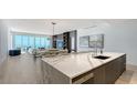 Contemporary kitchen with marble countertops that overlooks the living and dining areas and offers beautiful ocean views at 4651 Gulf Of Mexico Dr # 304, Longboat Key, FL 34228