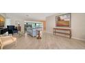 Spacious living room with fireplace, tile floors and modern furnishings at 5458 Golf Pointe Dr, Sarasota, FL 34243