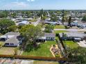 Sprawling backyard with lush green grass, a garden, and a privacy fence at 5704 2Nd Avenue Nw Dr, Bradenton, FL 34209