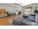 Comfortable living room with a large window, a gray sofa, and stylish decor at 5704 2Nd Avenue Nw Dr, Bradenton, FL 34209