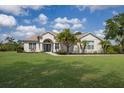 Inviting front exterior showcasing a well-manicured lawn and beautiful landscaping at 8223 Snowy Egret Pl, Bradenton, FL 34202