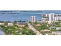 Panoramic aerial view of the community featuring water views, bridge, and nearby city skyline at 825 S Osprey Ave # 302, Sarasota, FL 34236