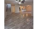 Spacious living room with open floor plan and modern ceiling fan at 940 Byron Ct # 17C, Sarasota, FL 34243