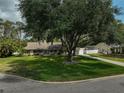 Beautiful single-story home boasting lush greenery, mature shade trees, and a long driveway at 13612 11Th E Ter, Bradenton, FL 34212