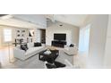 Bright living room with vaulted ceiling, comfortable seating, and open floor plan to the dining area at 3409 Montilla Ct # 8410, Sarasota, FL 34232