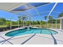 Relaxing screened-in pool and spa with tile trim, perfect for outdoor enjoyment and entertaining at 4412 Wolf Ridge Xing, Parrish, FL 34219