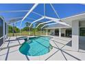 Beautiful enclosed pool with beautiful blue water, spa, and large patio at 4412 Wolf Ridge Xing, Parrish, FL 34219