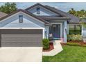 Charming home with a well-manicured lawn, inviting entry and a two car garage at 4509 95Th E Ter, Parrish, FL 34219