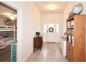 Welcoming foyer featuring neutral tile, ample natural light and views into the adjoining rooms at 4509 95Th E Ter, Parrish, FL 34219