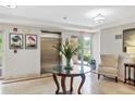 Well-maintained lobby area featuring a decorative table with floral arrangement and comfortable seating at 5238 Manorwood Dr # 3C, Sarasota, FL 34235