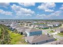 Aerial view of the home in a neatly planned community, showcasing the spacious backyard at 5715 Woodland Sage Dr, Sarasota, FL 34238