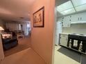 View from hallway into the kitchen, connected to a living room at 6072 Arlene Way # 6072, Bradenton, FL 34207