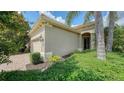 Charming home featuring a two-car garage, brick paved driveway, and well-maintained landscaping at 7158 Westhill Ct, Lakewood Ranch, FL 34202