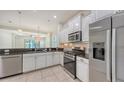 Modern kitchen featuring stainless steel appliances and white cabinetry at 7158 Westhill Ct, Lakewood Ranch, FL 34202