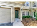 Charming front door with sidelights, complemented by a well-manicured front yard at 7576 Plantation Cir, Bradenton, FL 34201