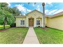 Charming home with a well-manicured lawn and inviting front entrance at 8136 Snowy Egret Pl, Bradenton, FL 34202