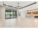 A spacious room with tile flooring and natural light overlooks the pool at 8936 Artisan Way, Sarasota, FL 34240