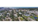 Extensive aerial view showcasing the neighborhood, surrounding greenery, city, and waterfront at 941 N Osprey Ave, Sarasota, FL 34236
