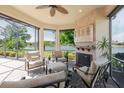 Inviting screened lanai with fireplace and scenic lake view at 12740 Del Corso Loop, Lakewood Ranch, FL 34211