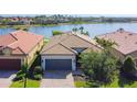 Stunning exterior shot showcases a well-manicured lawn and a charming one-story home with a tile roof at 13724 Quinta St, Venice, FL 34293