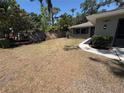 Expansive front yard showing the property's landscape and curb appeal in a residential setting at 1461 17Th St, Sarasota, FL 34234