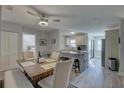 Open-concept kitchen with granite counters, modern appliances, and a dining area at 2825 74Th W St, Bradenton, FL 34209