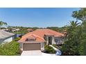 Stunning single-story home features a new tile roof and meticulously maintained landscaping at 4961 Sabal Lake Cir, Sarasota, FL 34238