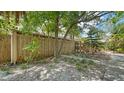 Landscaped yard with privacy fence and mature trees at 500 N Jefferson Ave # 5, Sarasota, FL 34237