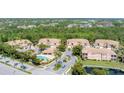 Community aerial view showcasing lush landscaping, ponds, pool area, and well-maintained exteriors at 5405 46Th W Ct, Bradenton, FL 34210