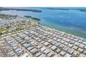 Overhead shot of a vibrant community nestled along the coast, featuring serene waterfront views at 10315 Cortez W Rd # 24H, Bradenton, FL 34210