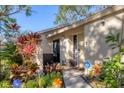 Charming front entrance with decorative plants, secure ADT security system, and well maintained walkway at 1533 42Nd Avenue E Dr # 48, Ellenton, FL 34222
