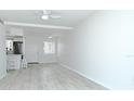 Spacious, bright and airy living space featuring durable flooring and a ceiling fan at 2227 Sunset Dr # E22, Bradenton, FL 34207