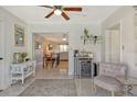 Cozy living area featuring a wine fridge, and a view to the adjacent dining area at 314 28Th W St, Bradenton, FL 34205