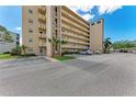 Condo building featuring a parking lot at 4040 Ironwood Cir # 401F, Bradenton, FL 34209