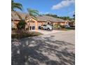 Exterior of the townhome with private driveways and well-kept landscaping at 4707 1St E Ave # 4707, Palmetto, FL 34221
