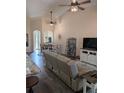 Open-concept living room with high ceilings and modern ceiling fans at 4707 1St E Ave # 4707, Palmetto, FL 34221