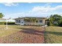 Attractive home featuring a brick-paved driveway and tidy landscaping, adding to its charm at 516 45Th Street W Ct, Palmetto, FL 34221