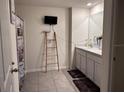 Spacious bathroom with double vanity, tile floors, and modern fixtures at 615 Sunlit Coral St, Ruskin, FL 33570