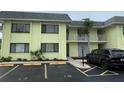 Inviting condo building featuring a well-maintained exterior and convenient parking at 6703 Midnight Pass Rd # 206, Sarasota, FL 34242
