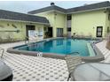 Community pool and surrounding area at 6703 Midnight Pass Rd # 206, Sarasota, FL 34242