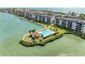 Waterfront condos feature a pool and bay access at 8977 Midnight Pass Rd # 519, Sarasota, FL 34242