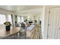 Bright and airy living room with modern floors and a white brick fireplace at 1028 36Th E Ave, Ellenton, FL 34222