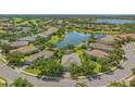 Beautiful lakefront home surrounded by mature trees in an established neighborhood at 14350 Stirling Dr, Lakewood Ranch, FL 34202