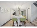 Bright kitchen island featuring sleek countertops and stylish barstool seating at 1586 Dorgali Dr, Sarasota, FL 34238
