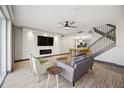 Modern living room featuring stylish furniture, sleek fireplace, and contemporary design elements at 1586 Dorgali Dr, Sarasota, FL 34238